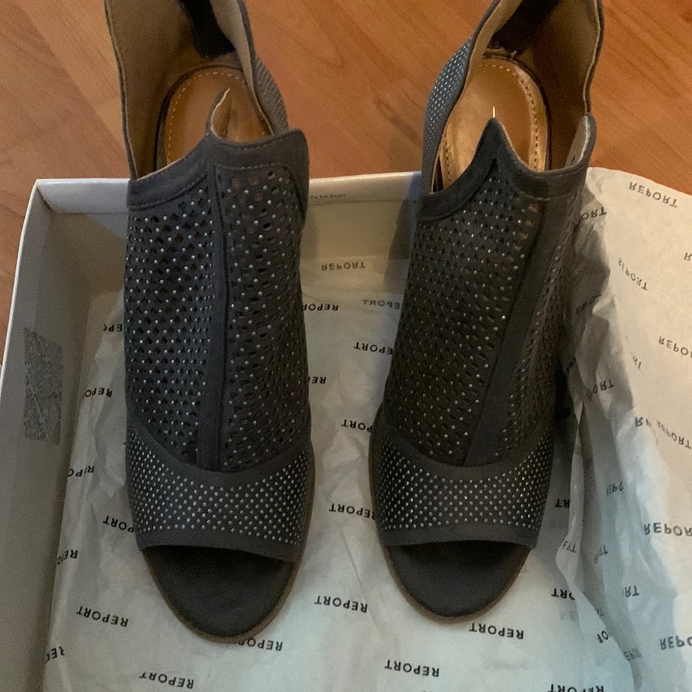 Report gray bootie never wore  the heel was too high. I love the style